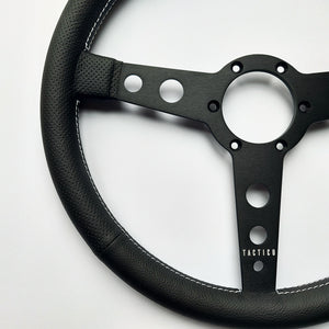 Flat steering wheel of 350 mm shown in air-cooled leather.