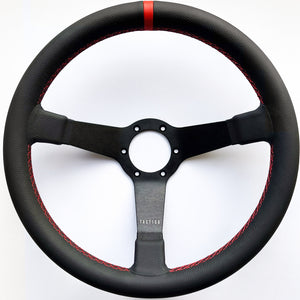 Custom steering wheel in black aluminum, full grain leather and red stitching by Tactico Racing Atelier