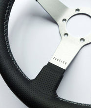 Custom steering wheel in brushed aluminum with perforated leather by Tactico Racing Atelier