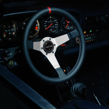Custom steering wheel in brushed aluminum with perforated leather installed on a Porsche 911 by Tactico Racing Atelier
